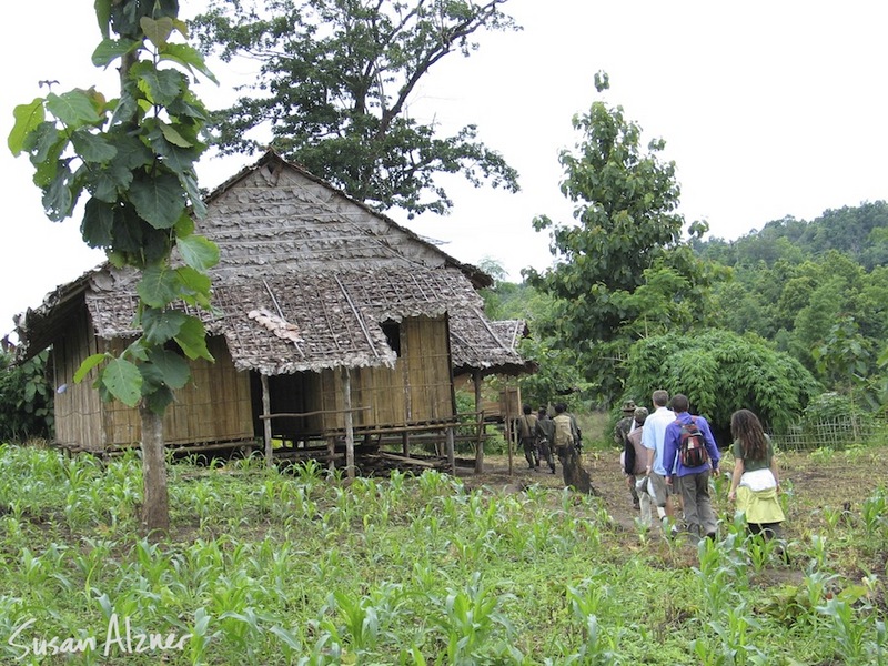 Ani DiFranco and Damien Rice walking into a village in the Karen State of Burma