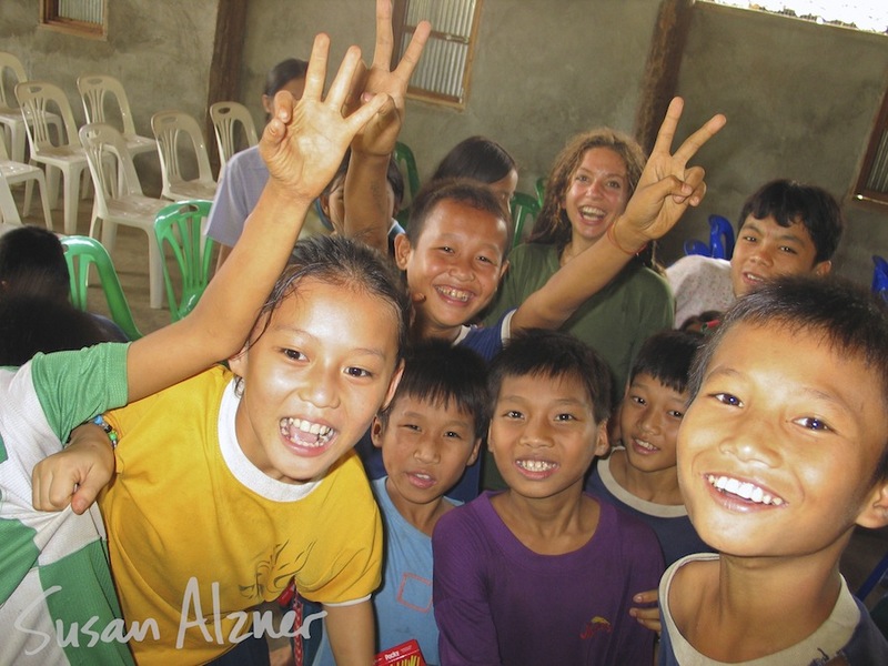Ani DiFranco visits with children at a Burmese refugee camp orphanage on the border of Thailand and Burma