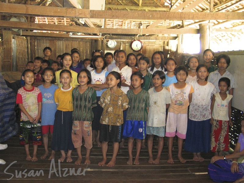 Residents at a Burmese refugee camp orphanage on the border of Thailand and Burma sing for Ani DiFranco and Damien Rice 