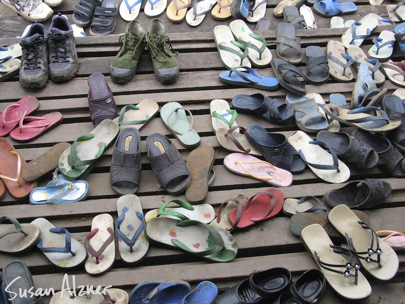 Western shoes hanging out with Burmese flip flops while Ani DiFranco and Damien Rice share music with school children in the Karen State of Burma